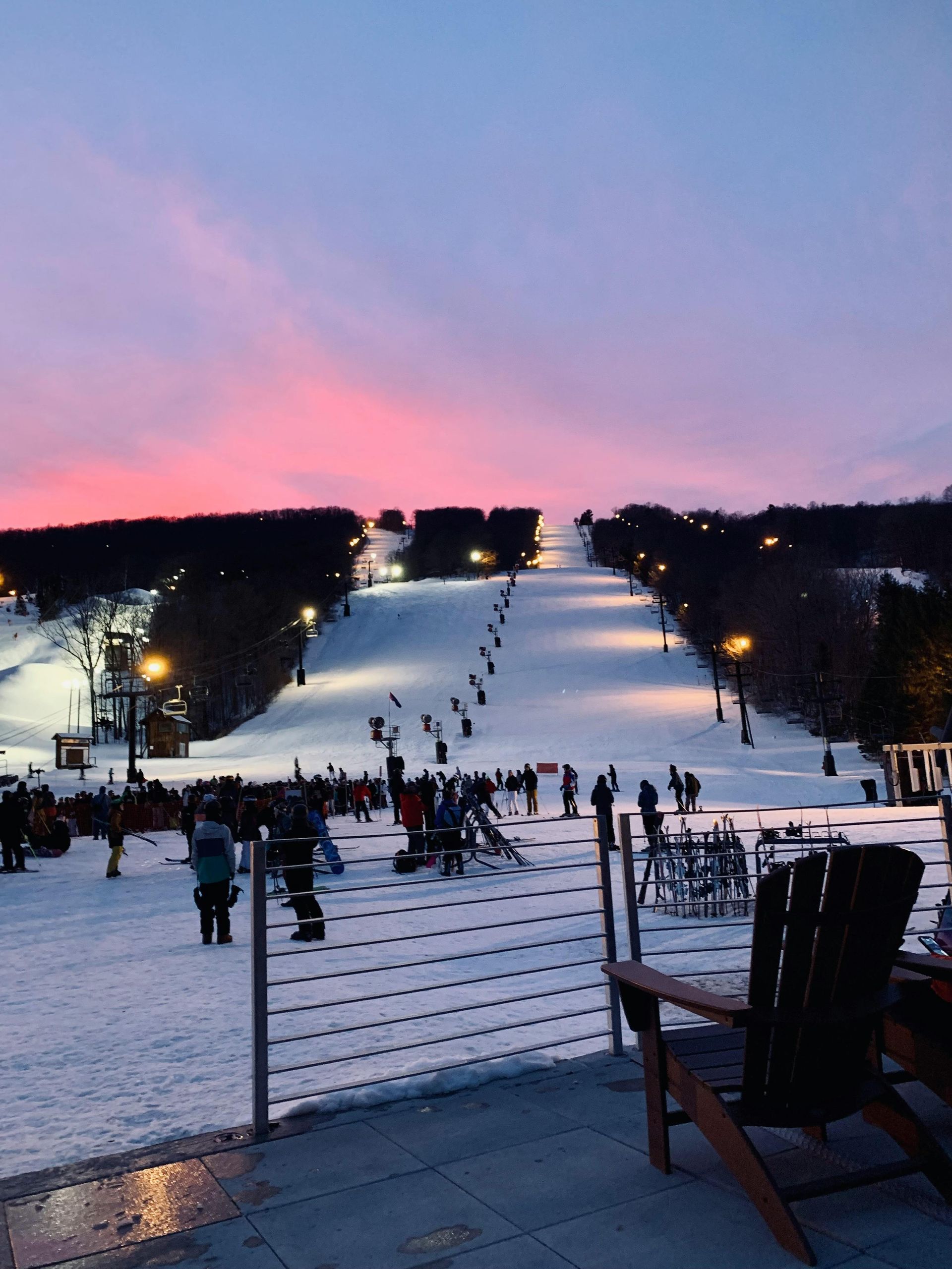 Skiers at dusk on Park City Mountain